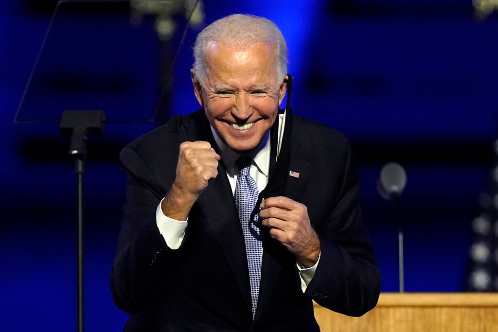 (Andrew Harnik | AP file photo)  President-elect Joe Biden gestures to supporters Saturday, Nov. 7, 2020, in Wilmington, Del.