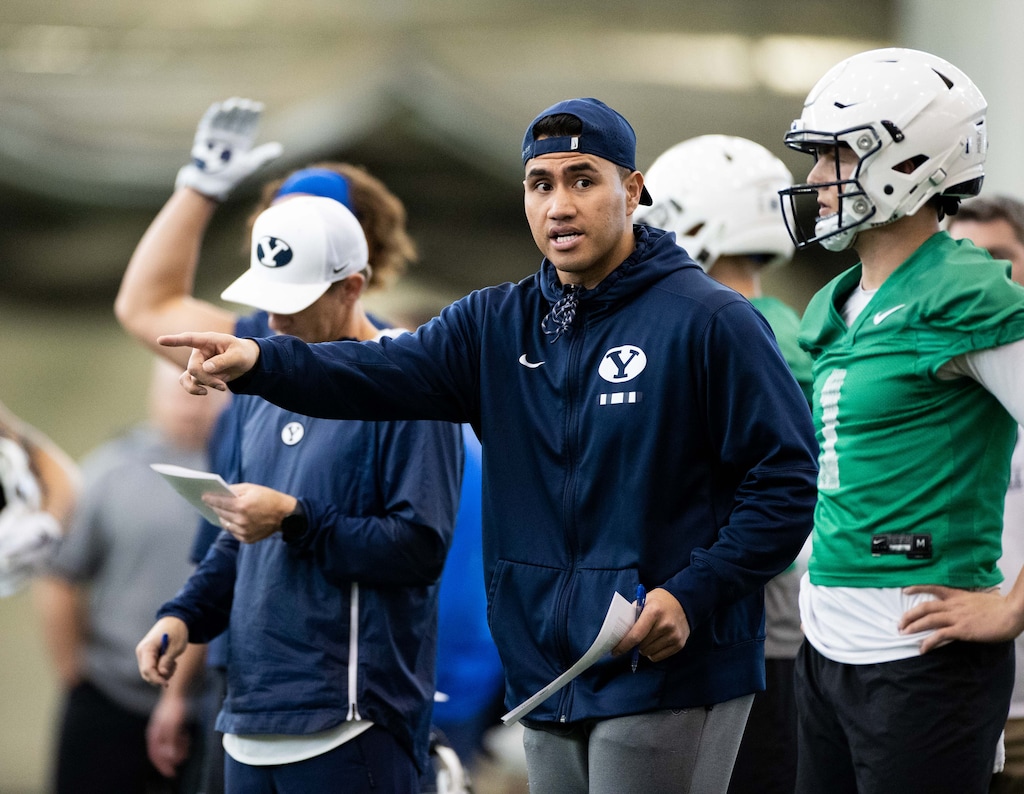 (Photo courtesy of Jaren Wilkey | BYU Athletics) New BYU running backs coach Harvey Unga puts his players through their paces at a recent BYU football spring practice.