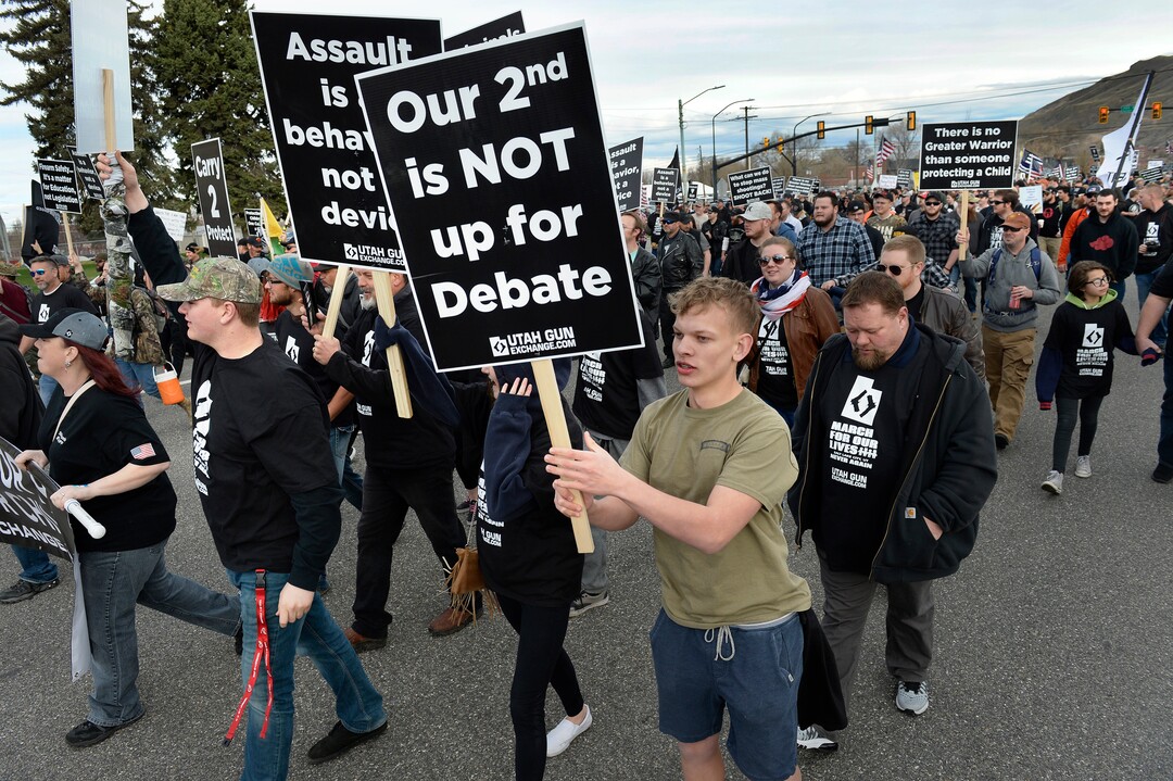 (Scott Sommerdorf | The Salt Lake Tribune) The pro gun "March Before Our lives" marchers begin their march to the Capitol building from West High School, Saturday, March 24, 2018.
