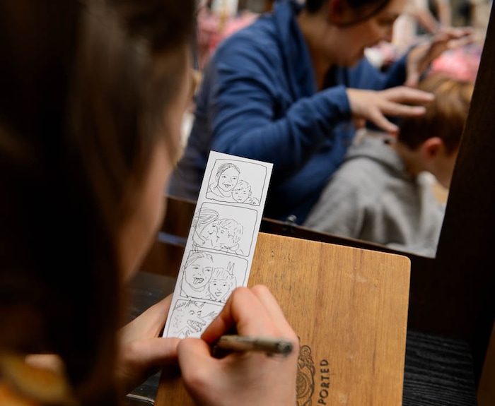 (Trent Nelson | The Salt Lake Tribune)  Natalie Allsup-Edwards, the artist behind the Hand Drawn Photo Booth, sketches Bella and Dexter Church at the Tumbleweeds Film Festival, Saturday March 3, 2018.