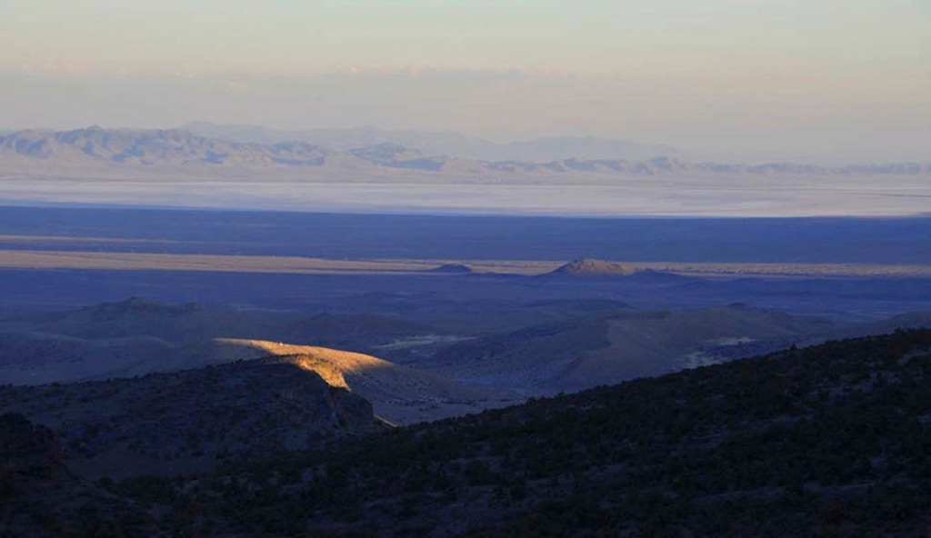 This undated image provided by the Southern Utah Wilderness Alliance, a ray of sunlight peeks through clouds above western Utah’s House Range just north of Sevier Lake in Millard County, Utah. (Southern Utah Wilderness Alliance)