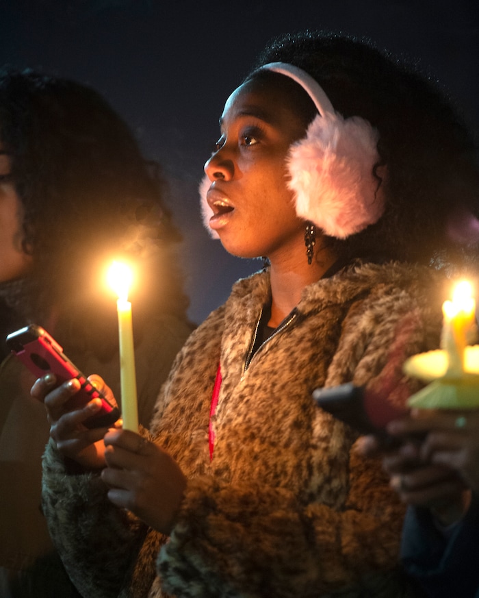 (Rick Egan  |  The Salt Lake Tribune)      Jodian Grant, sings with the BYU Women of Color club, during a candlelight vigil on BYU campus, for the student who died by suicide this week, at the Tanner Building, Friday, Dec. 7, 2018.