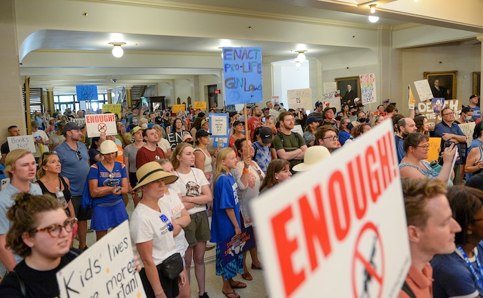 (Chris Samuels | The Salt Lake Tribune) Marchers hold signs and chant in support of increased gun safety measures at the Capitol in Salt Lake City, Saturday, June 11, 2022.