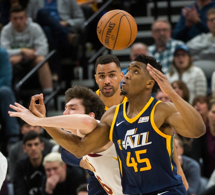 (Rick Egan  |  The Salt Lake Tribune)   Utah Jazz guard Donovan Mitchell (45) steals the ball from Cleveland Cavaliers forward Cedi Osman (16), in NBA action Utah Jazz vs Cleveland Cavaliers, in Salt Lake City,  Saturday, December 30, 2017.


