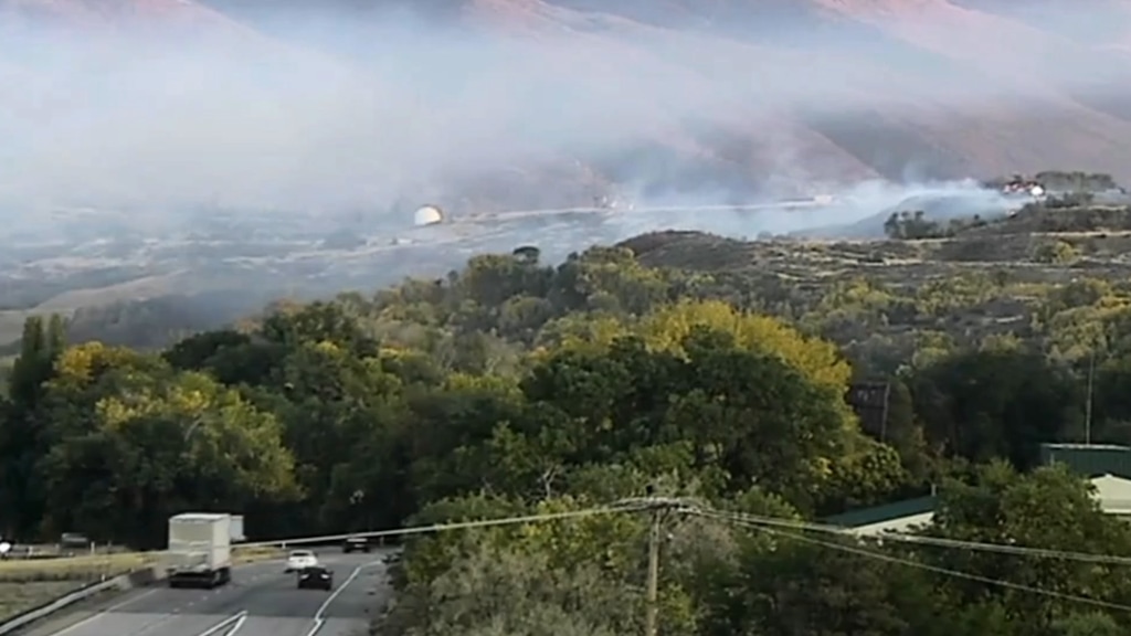 (UDOT via Fox13 News) An image from a Utah Department of Transportation traffic camera shows emergency crews responding to a crashed F-35 fighter jet at Hill Air Force Base, Wednesday, Oct. 19, 2022.