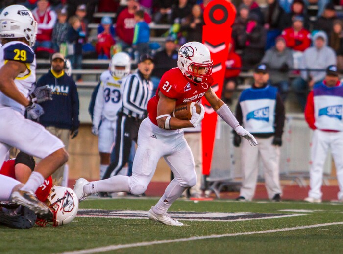 Southern Utah running back Jay Green Jr. (21) carries the ball for a first down during an NCAA college football game against Northern Arizona, Saturday, Nov. 18, 2017, in Cedar City, Utah. Southern Utah defeated Northern Arizona 48-20 to claim a share of the Big Sky Conference title. (Jordan Allred/The Spectrum via AP)