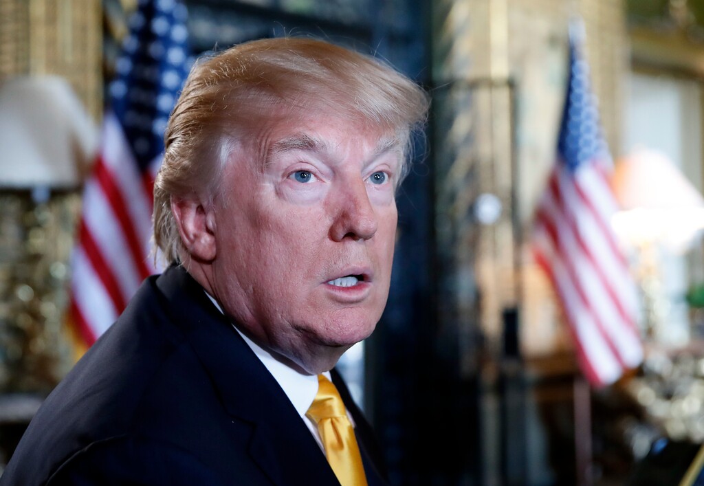 FILE - In this Thursday, Nov. 23, 2017 file photo, President Donald Trump speaks to the media before speaking with members of the armed forces via video conference at his private club, Mar-a-Lago, on Thanksgiving in Palm Beach, Fla. Trump says he's not playing ball with Time magazine as it decides its Person of the Year. The magazine counters that Trump has it all wrong. In a tweet Friday, Nov. 24, 2017, as he spent the Thanksgiving holiday in Florida, Trump sounded dismissive of the honor he received last year and could well receive again. (AP Photo/Alex Brandon, File)