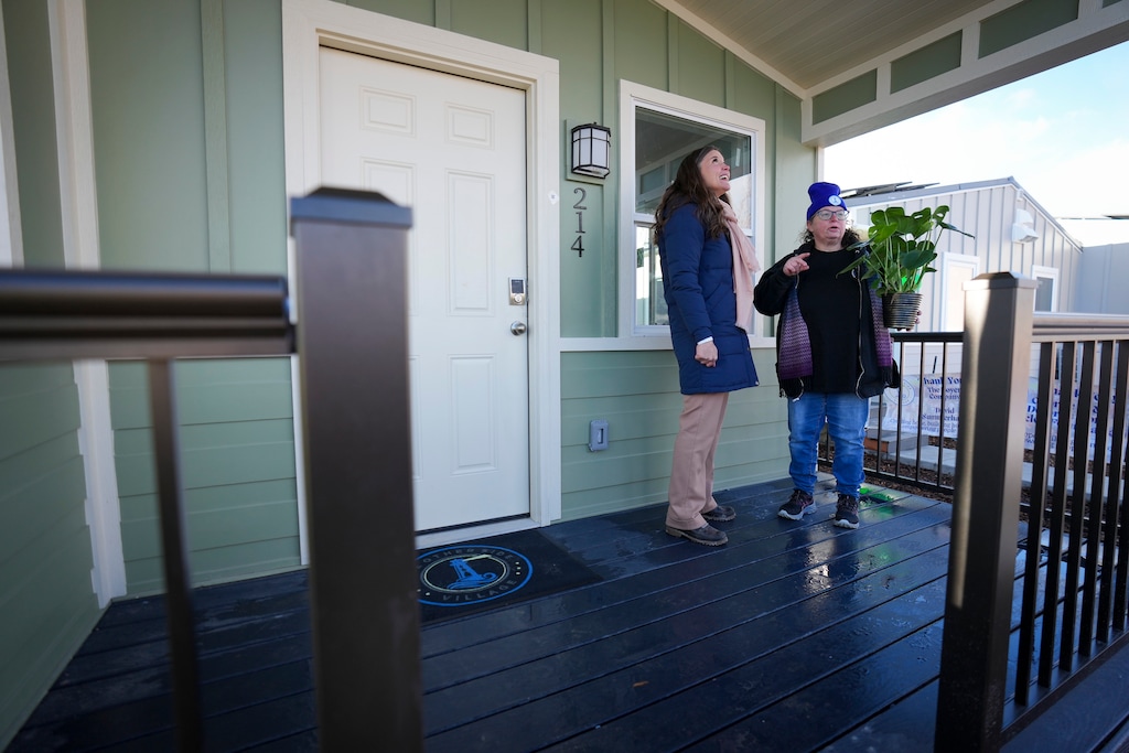(Bethany Baker | The Salt Lake Tribune) Salt Lake City Mayor Erin Mendenhall, left, speaks with Lori McQueen, a new villager moving into her home at The Other Side Village in Salt Lake City on Monday, Dec. 30, 2024.