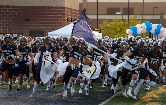 (Rick Egan | The Salt Lake Tribune) Corner Canyon takes the field for prep football action between the Corner Canyon Chargers and the Bingham Miners, on Friday, Aug. 27, 2021.