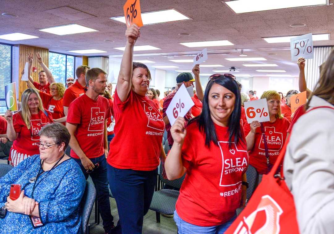 (Leah Hogsten  |  The Salt Lake Tribune) Teachers walk out of the public comment period at the Salt Lake City School District meeting regarding salary negotiations, June 4, 2019. More teachers are leaving Utah classrooms and one of the biggest reasons they cite is low pay. The state now has a shortage of 1,600 educators with the imbalance expected to get worse.