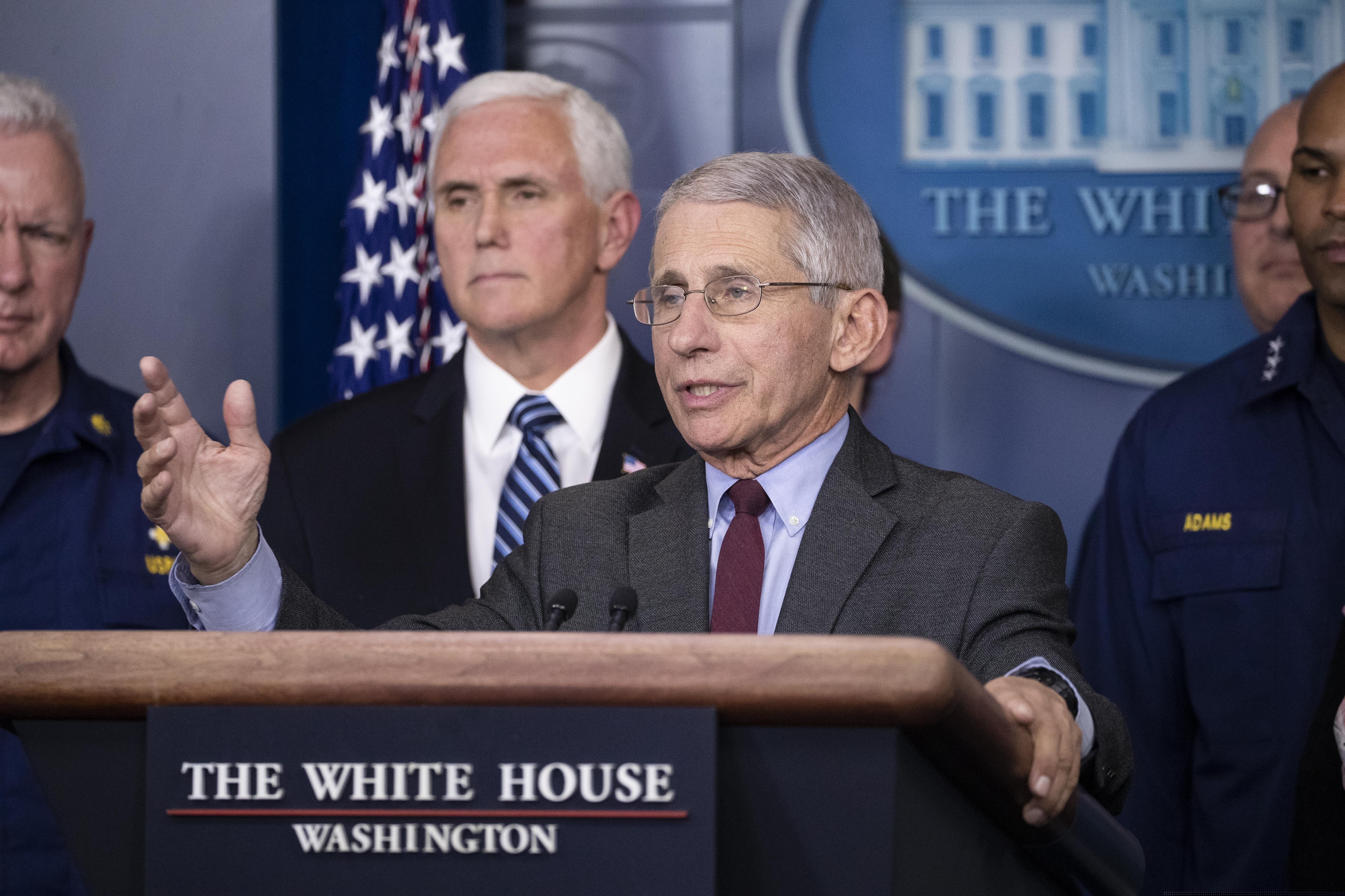 (Alex Brandon | AP) Dr. Anthony Fauci, director of the National Institute of Allergy and Infectious Diseases, with Vice President Mike Pence behind him, speaks during a briefing about the coronavirus in the James Brady Press Briefing Room of the White House, Sunday, March 15, 2020, in Washington.