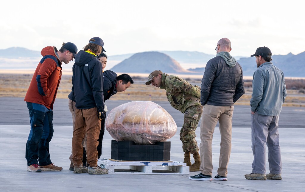 (Rick Egan | The Salt Lake Tribune)  Workers from Varda Space Industries check out the capsule at the Wendover Airport after it landed in the West Desert on Wednesday, Feb. 21, 2024.