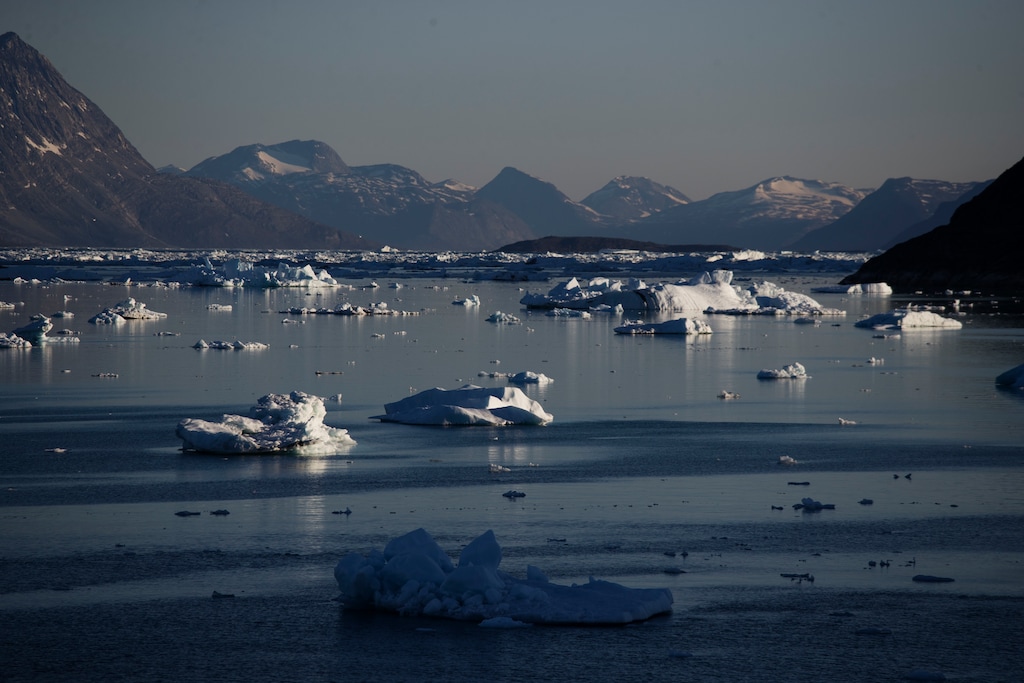 FILE - In this Tuesday, Aug. 1, 2017, file photo, icebergs float in the Nuup Kangerlua Fjord after breaking off a glacier on Greenland's ice sheet in southwestern Greenland. In a year of cataclysm, some world leaders at September 2020's annual United Nations meeting are taking the long view, warning: If COVID-19 doesn't kill us, climate change will. With Siberia seeing its warmest temperature on record this year and enormous chunks of ice caps in Greenland and Canada sliding into the sea, countries are acutely aware there's no vaccine for global warming. (AP Photo/David Goldman, File)