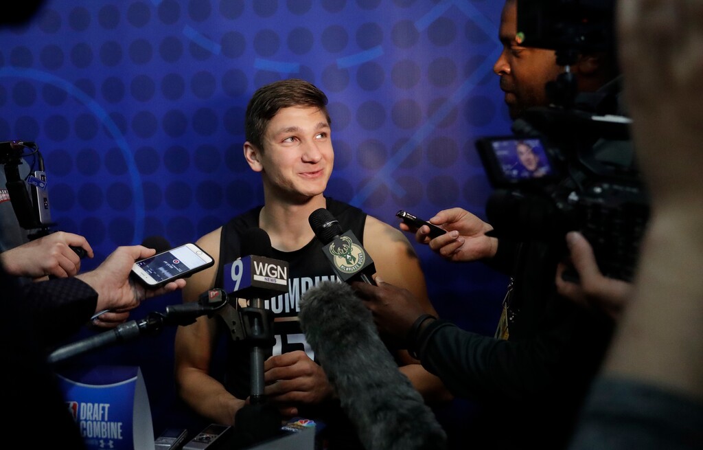 Grayson Allen, from Duke, listens to a question as he speaks with reporters at the NBA draft basketball combine Thursday, May 17, 2018, in Chicago. (AP Photo/Charles Rex Arbogast)
