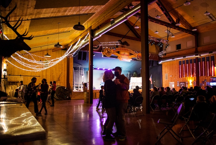 (Rick Egan | The Salt Lake Tribune) Couples dance during a concert by the "Bryce Canyon Wranglers" at Ebenezer's, during the 36th annual Bryce Canyon Winter Festival on Saturday, Feb. 13, 2021.