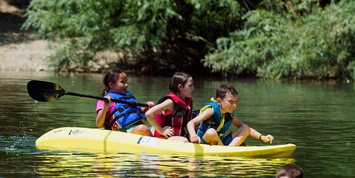 (Rick Egan  |  The Salt Lake Tribune)    Adalie Deleon Brynlee Thompson, Easton Gines, beat the heat by splashing around in kayaks on Farmington Pond, Thursday, July 26, 2018.