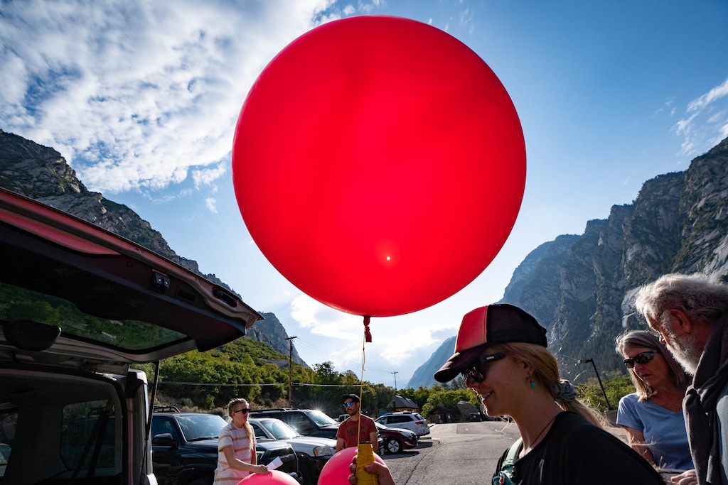 (Francisco Kjolseth | The Salt Lake Tribune) Environmental activist Dani Poirier gets ready to fly a large balloon over the mouth of Little Cottonwood Canyon on Saturday, Aug. 21, 2021, to demonstrate the height of gondola towers the Utah Department of Transportation is proposing be built to carry people up to Alta and Snowbird ski resorts.
