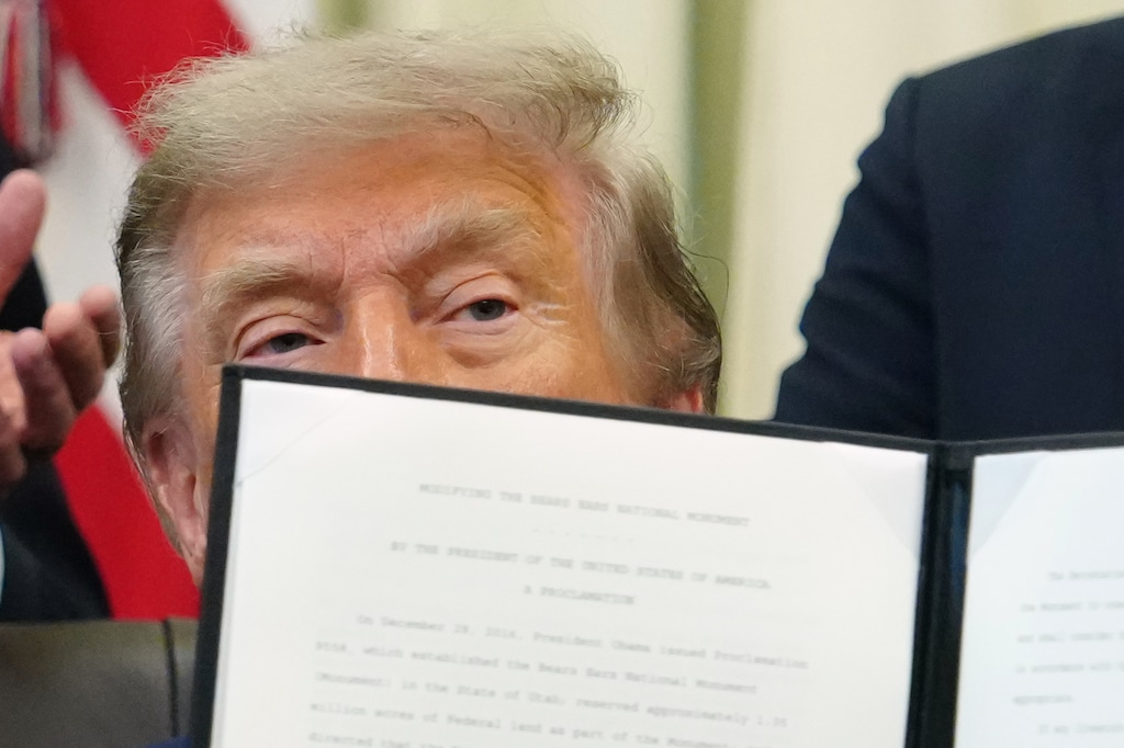 (Julia Demaree Nikhinson | AP) President Donald Trump holds a signed executive order modifying the Bears Ears National Monument in the Oval Office of the White House, Monday, July 13, 2026, in Washington.