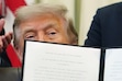 (Julia Demaree Nikhinson | AP) President Donald Trump holds a signed executive order modifying the Bears Ears National Monument in the Oval Office of the White House, Monday, July 13, 2026, in Washington.
