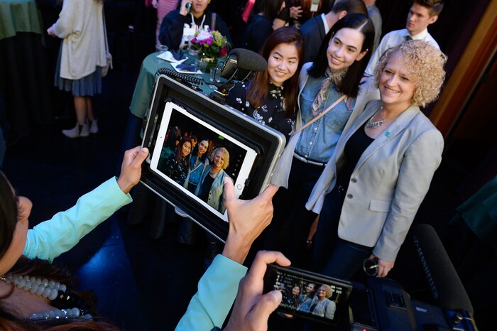 (Francisco Kjolseth  |  The Salt Lake Tribune)  Mayor Jackie Biskupski poses for photos with Gracie Kilminster, 17, left, and Camille Whisenant, 18, both seniors at Highland High after they won a ticket to attend Hamilton with the mayor on Thursday, April 19, 2018. The students were among many who wrote to a politician on topics important to them and to offer solutions as part of the New Nation Project. 