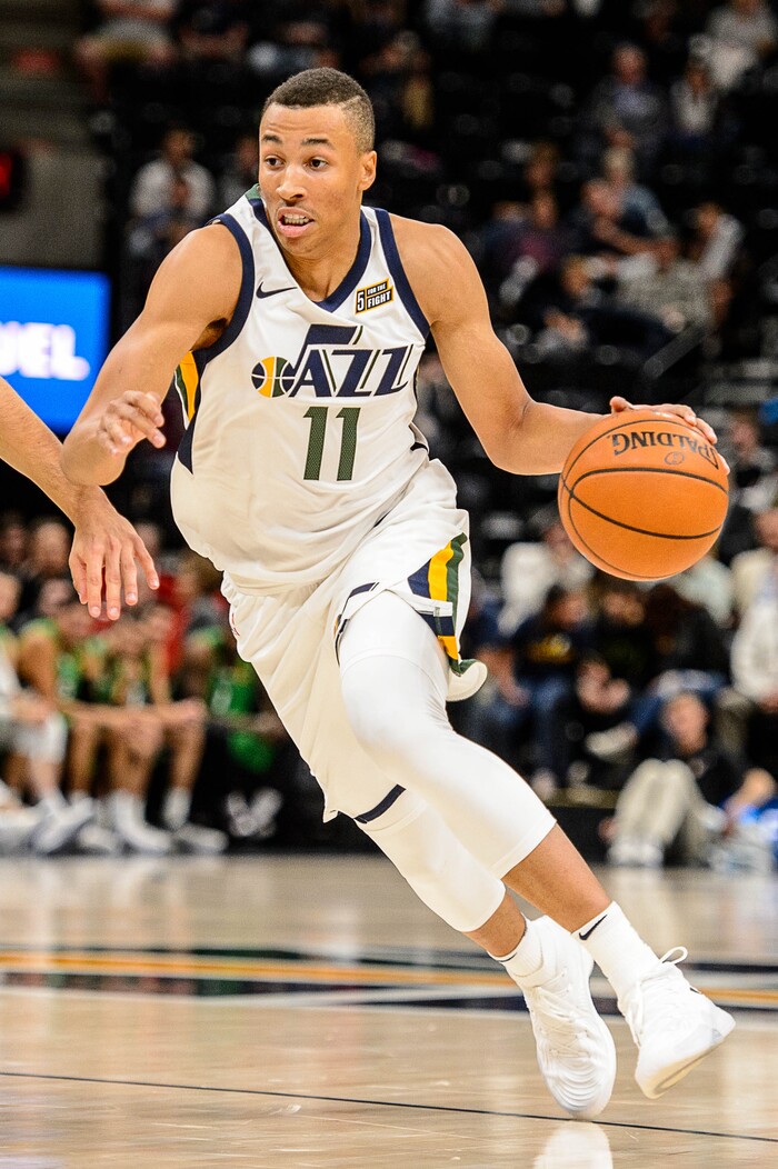 (Trent Nelson | The Salt Lake Tribune)  Utah Jazz guard Dante Exum (11) drives on Maccabi Haifa's Roi Huber as the Utah Jazz host Maccabi Haifa, preseason NBA basketball at Vivint Smart Home Arena in Salt Lake City Wednesday October 4, 2017.