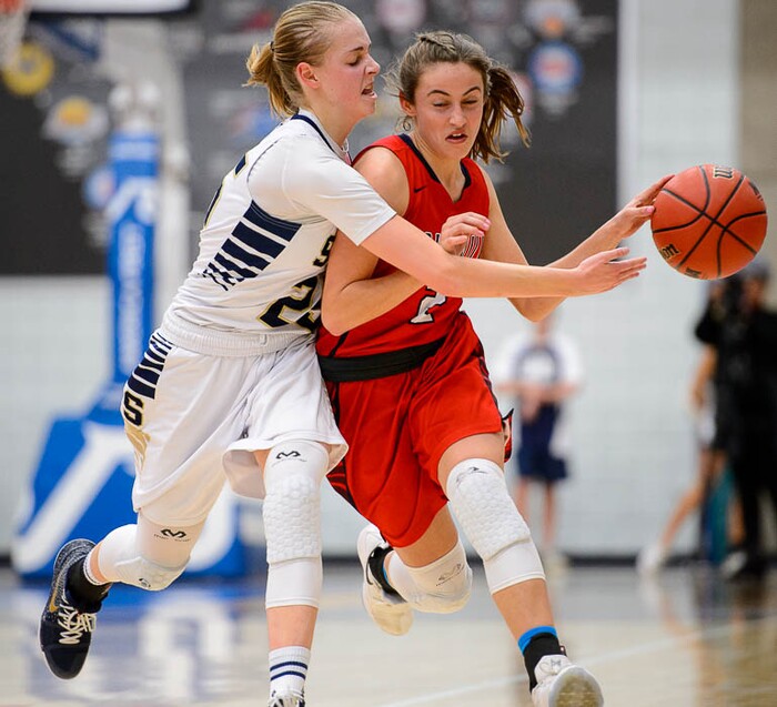 (Trent Nelson | The Salt Lake Tribune)  Skyline's Madison Grange (25) knocks the ball away from Springville's Tara Warner (2) as Skyline faces Springville in the 5A High School Girls' Basketball Tournament at SLCC in Taylorsville, Wednesday Feb. 21, 2018.