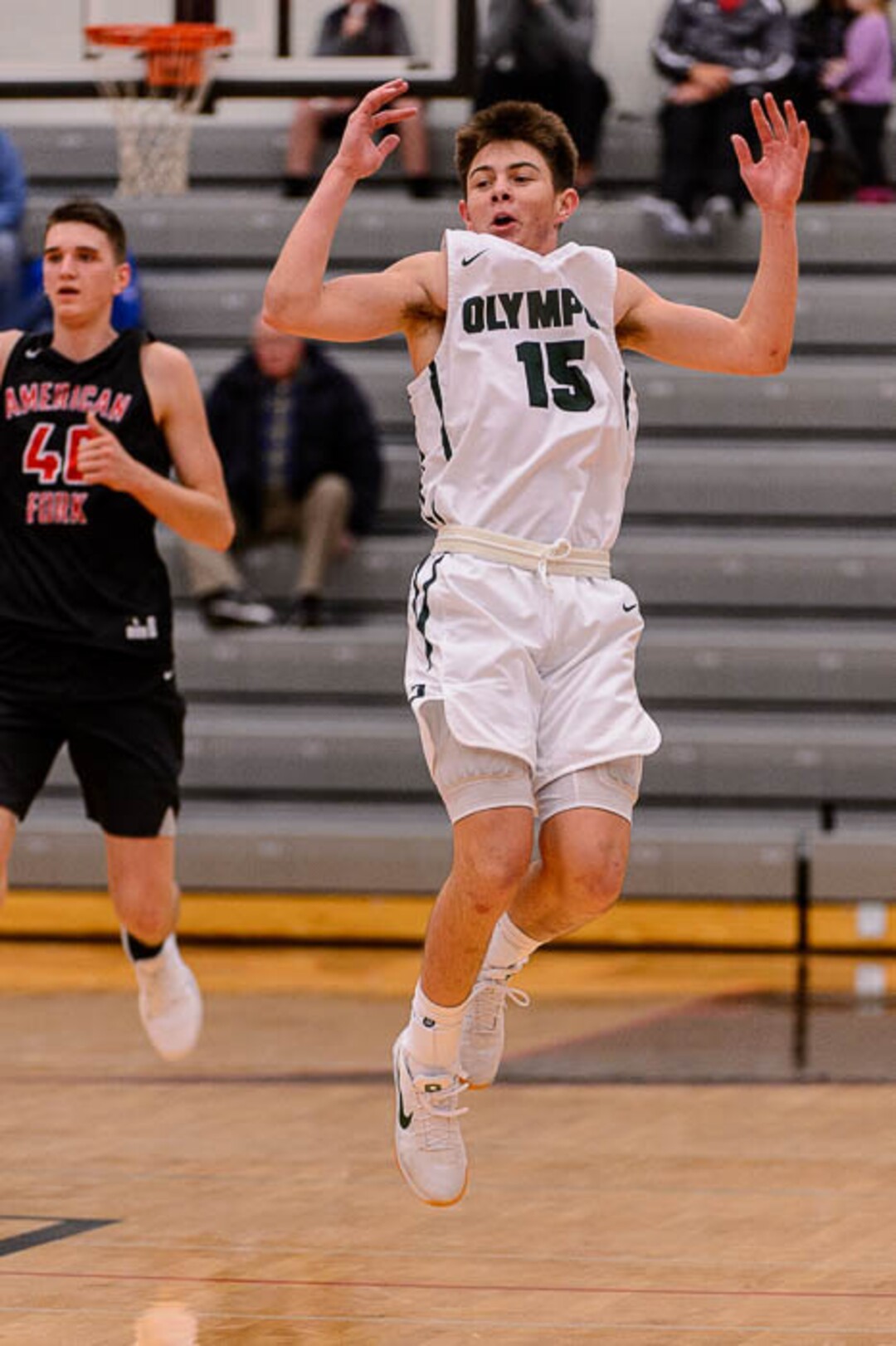 (Trent Nelson | The Salt Lake Tribune)  Olympus's Rylan Jones celebrates a basket as American Fork hosts Olympus in the Utah Elite Eight tournament, Saturday December 9, 2017.
