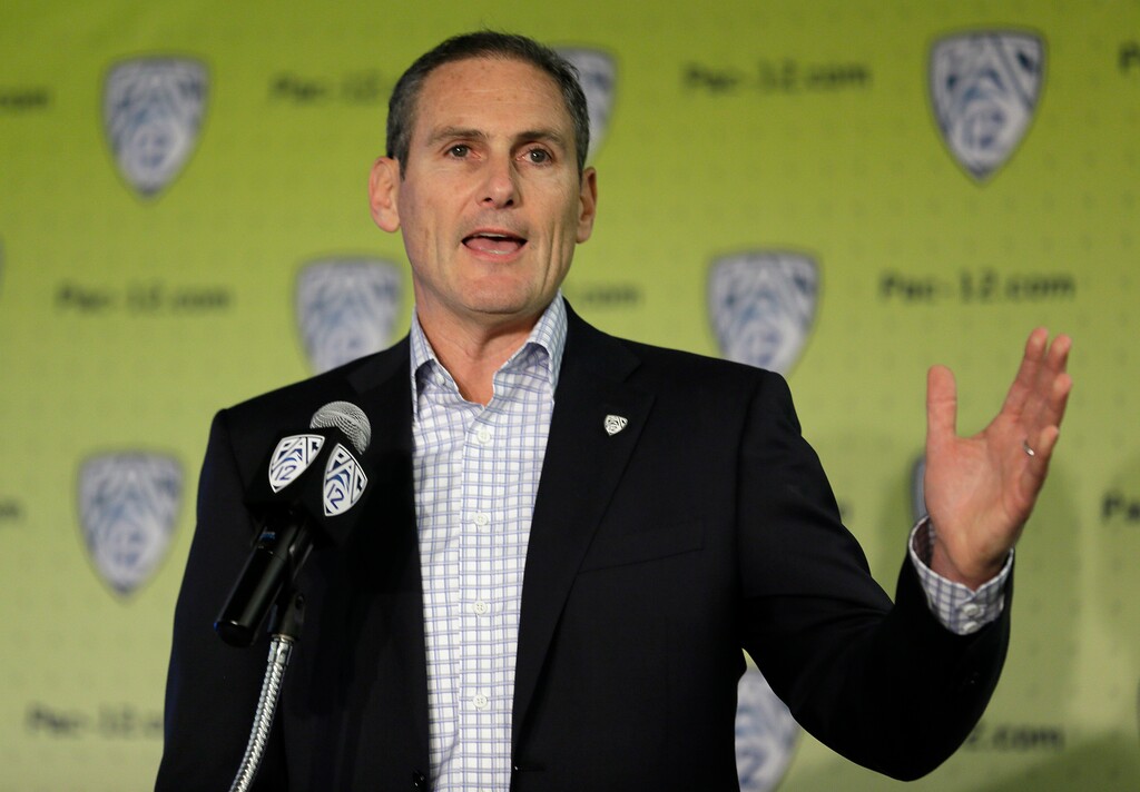 FILE - In this Oct. 12, 2017, file photo, Commissioner Larry Scott gestures while speaking about the formation of a task force on recruitment issues during NCAA college basketball Pac-12 media day, in San Francisco. Top leaders from the major professional sports leagues and individual franchises are looking at ways to avoid the kinds of sexual misconduct scandals that have rocked politics and the entertainment industry. The Anti-Defamation League's new Sports Leadership Council, chaired by Pac-12 Conference Commissioner Larry Scott and also featuring key civil rights activists and women's sports advocates and representatives, held its first meeting last week in New York. In attendance were NFL Commissioner Roger Goodell and Major League Baseball Commissioner Rob Manfred, NCAA President Mark Emmert along with other top leaders such as Big East Commissioner and former WNBA President Val Ackerman, various pro sports owners and team presidents.(AP Photo/Eric Risberg, File)