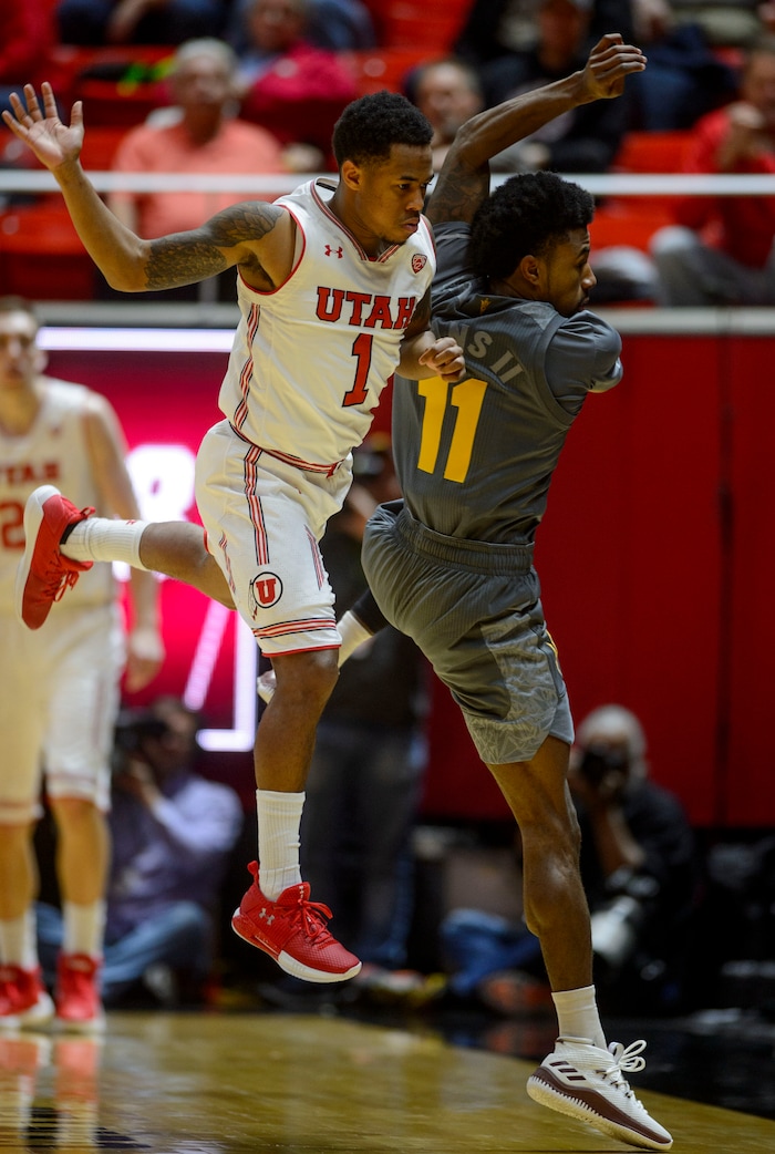 (Steve Griffin  |  The Salt Lake Tribune) Utah Utes guard Justin Bibbins (1) and Arizona State Sun Devils guard Shannon Evans II (11) collide while going for the a loose ball during the Utah Utes versus Arizona State Sun Devils at the Huntsman Center on the University of Utah campus in Salt Lake City Sunday January 7, 2018.