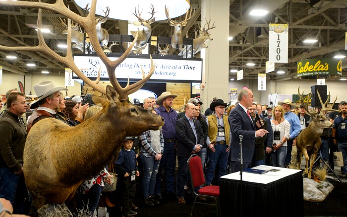 (Steve Griffin  |  The Salt Lake Tribune)  U.S. Secretary of the Interior Ryan Zinke stands with people attending the Western Hunting and Conservation Expo at the Salt Palace Convention Center as he prepares to sign Secretarial Order 3362, which will improve habitat quality and western big game winter range and migration corridors for big game, in Salt Lake City Friday February 9, 2018.