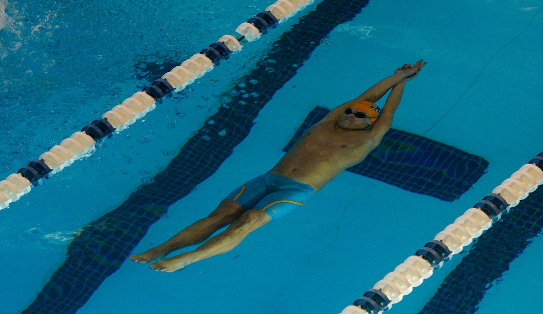 (Leah Hogsten  |  The Salt Lake Tribune)  Brighton High School's Taua Fitisemanu swims the 100 yard backstroke in 55.14 at the Class 5A State Championships in Bountiful, Saturday, February 10, 2018. 