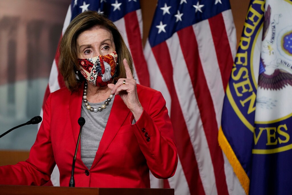 (Jacquelyn Martin | The Associated Press) House Speaker Nancy Pelosi of Calif., speaks to the media, Wednesday Dec. 30, 2020, on Capitol Hill in Washington. Nancy Pelosi was narrowly reelected Sunday as speaker.