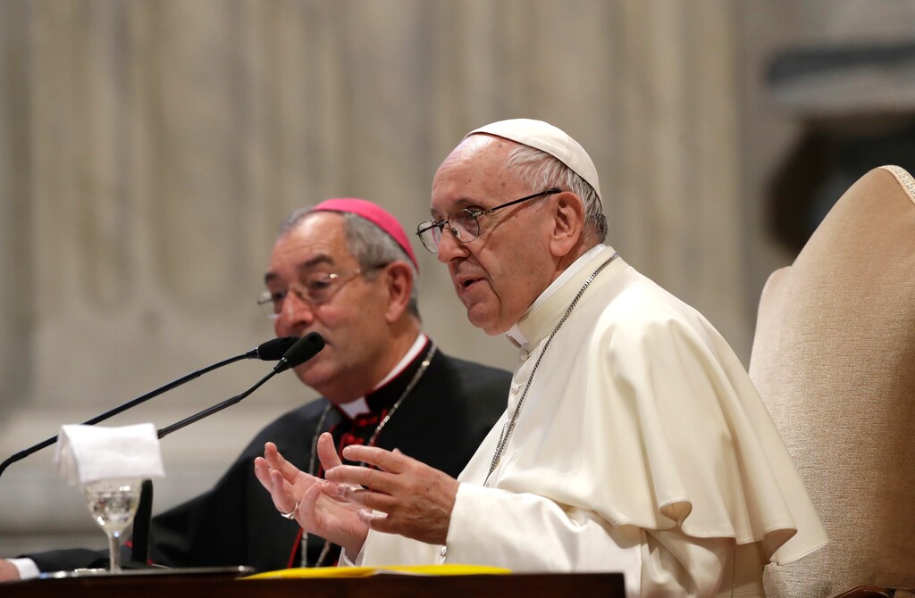 (AP Photo/Alessandra Tarantino) Pope Francis, flanked by Bishop Angelo De Donatis, speaks during a meeting with the Roman diocese, at the Vatican Basilica of St. John Lateran, in Rome, Monday, May 14, 2018.
