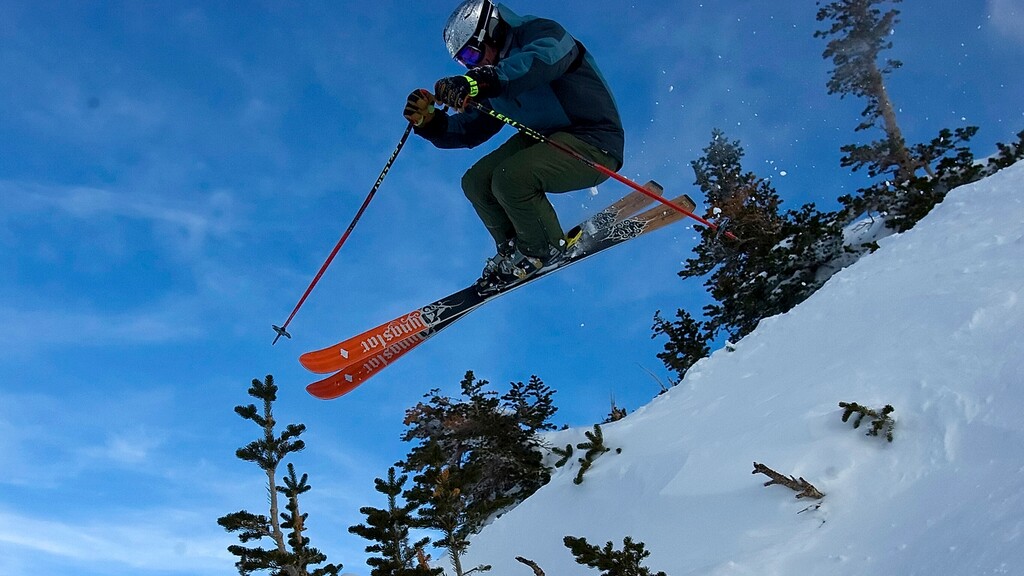 (Chris Detrick | Tribune file photo) William Kerig flies through the air while skiing down Snowbird's Regulator Johnson run on Christmas Eve 2017. The ski and snowboard season opens around the state later this month.