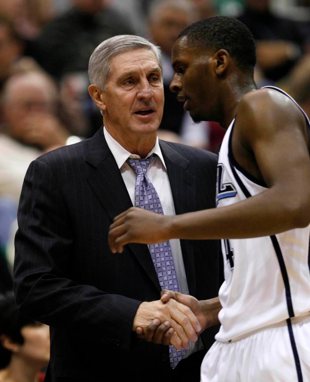 (Trent Nelson  |  Tribune file photo) Jerry Sloan shakes hands with C.J. Miles during Sloan's 1,000th victory as coach of the Jazz on Nov. 7, 2008.