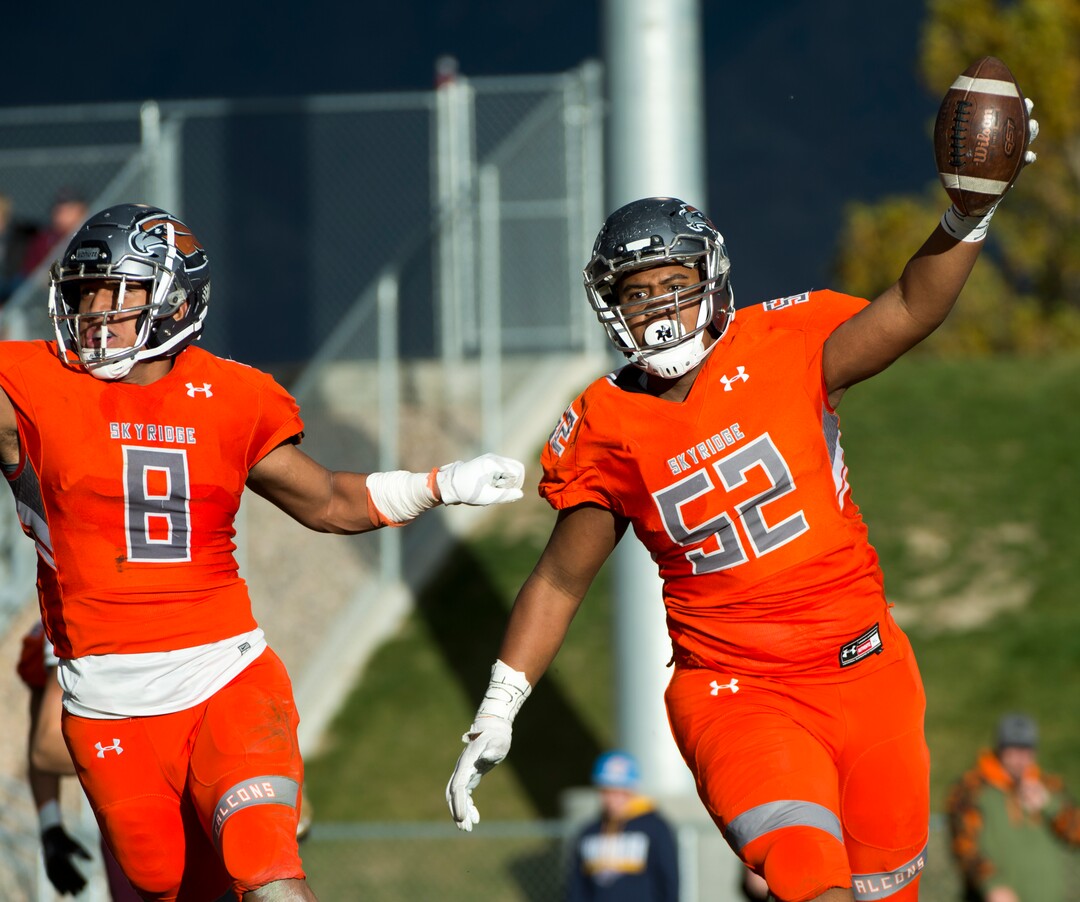 (Rick Egan  |  The Salt Lake Tribune)   Skyridge Stone Mulitalo (52) celebrates after intercepting a pass and scoring a touchdown, in prep 5A playoff action, in Lehi, Friday, Nov. 2, 2018.