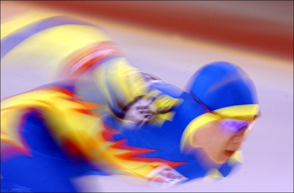 (Danny La  |  Tribune file photo)  The colorful suit of South Korea's Sang-Yeop Yeo blurs by  in a turn Men's 1500 meter Speed Skating at the Utah Olympic Oval in Kearns, Utah during the 2002 Winter Games. Salt Lake officials were accused of blurring lines by offering bribes to IOC officials in exchange for their vote for Utah to host the Olympics. That and other scandals resulted in a sharp reduction of members on the U.S. Olympic and Paralympic Committee board of directors, but the USOPC is slowly adding members back in.