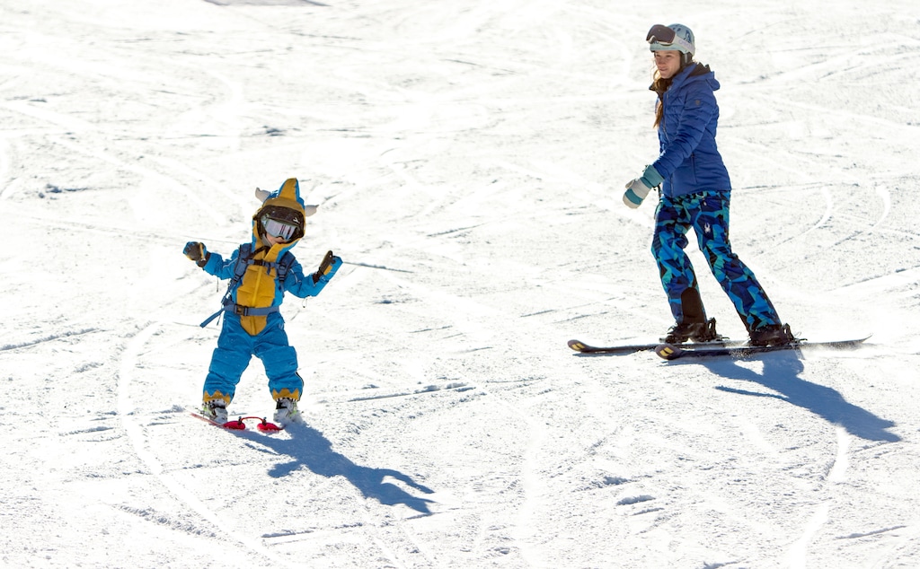 (Rick Egan | The Salt Lake Tribune) Roxy Bell skies with her 3-year-old son, David Bell, on the first day of skiing at Solitude, on Friday, Nov. 8, 2024. Single- and multi-day ski passes for adults and children are currently allowable expenses under Utah’s $82 million school voucher program, but a Utah bill aims to end that.