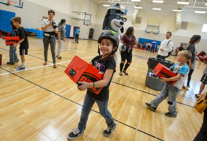 Steve Griffin  |  The Salt Lake TribuneAlexy Zepeda, 6, smiles as she wears her new bike helmet at the Lied Boys & Girls Club in Salt Lake City Friday July 28, 2017.  UnitedHealthcare donated helmets to help encourage kids and families to participate in the Tour of Utah kidsÕ events. Club youth will received the helmets and a helmet-fitting from UnitedHealthcare Pro Cycling Team members, as well as a lesson in helmet and bike safety.