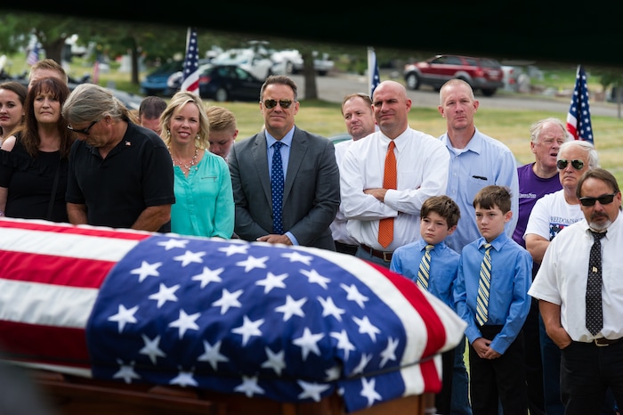 (Alex Gallivan  |  Special to The Tribune) Marine Pfc. Robert K. Holmes, who died 77 years ago aboard the USS Oklahoma during the attack on Pearl Harbor, is laid to rest in the Salt Lake City Cemetery, Monday, Aug. 20, 2018.
