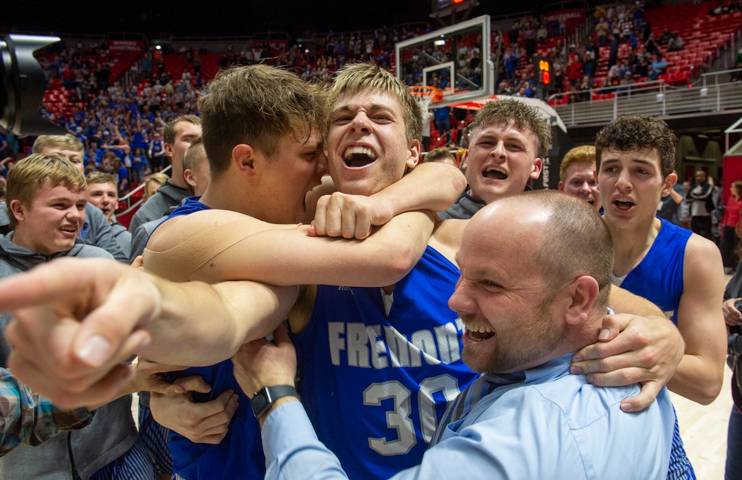 (Rick Egan  |  The Salt Lake Tribune)    Fremont Silverwolves Mitch Stratford (12)  and Dallin Hall (30), celebrate their win over the Davis Darts, in the 6A basketball championship game at the Jon M. Huntsman Center, Saturday Feb. 29, 2020