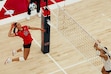 (Utah Tech University) Utah Tech volleyball player Kennedi Knudsen attempts to spike the ball over a defender.