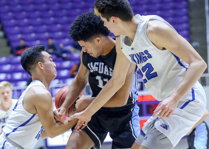 (Leah Hogsten  |  The Salt Lake Tribune) West Jordan's Darrian Nebeker (11) gets the ball stripped by Pleasant Grove's Matt Van Komen (22) and Pleasant Grove's Kainoa Maldonado (15). Pleasant Grove defeated West Jordan 62-54 in the 6A High School Boys' Basketball Tournament opening game at Weber State University’s Dee Events Center in Ogden,  Tuesday, Feb. 27, 2018. 