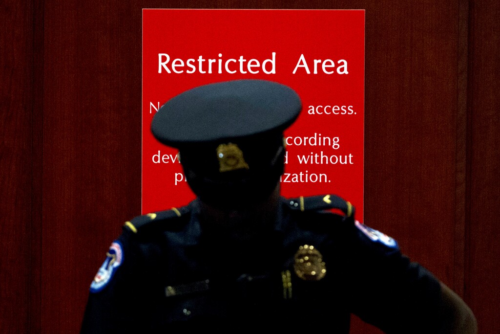 (Jose Luis Magana | AP Photo) A U.S. Capitol Police officer stands at the entrance to a secure area during closed-door interviews with Kurt Volker, a former special envoy to Ukraine, as House Democrats proceed with the impeachment investigation of President Donald Trump, at the Capitol in Washington, Thursday, Oct. 3, 2019.