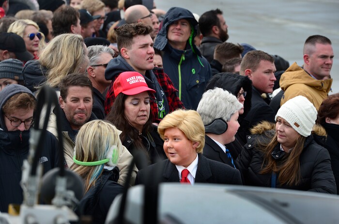 (Scott Sommerdorf   |  The Salt Lake Tribune)   Two young boys dressed as Trump waited for the arrival of Air Force One at the Ronald R Wright National Air Guard Base, Monday, December 4, 2017.  