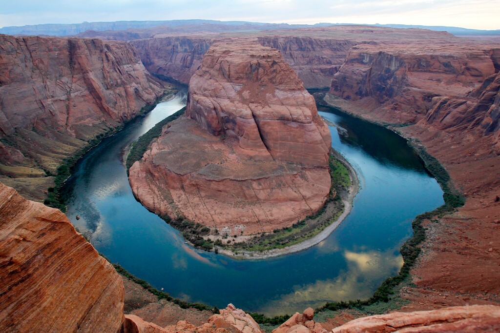 This Sept. 9, 2011 photo shows the  dramatic bend in the Colorado River at a the popular Horseshoe Bend in Glen Canyon National Recreation Area, in Page, Ariz. The spot is so popular that authorities have imposed parking restrictions for safety, and a new viewing deck has also been built recently. (AP Photo/Ross D. Franklin)