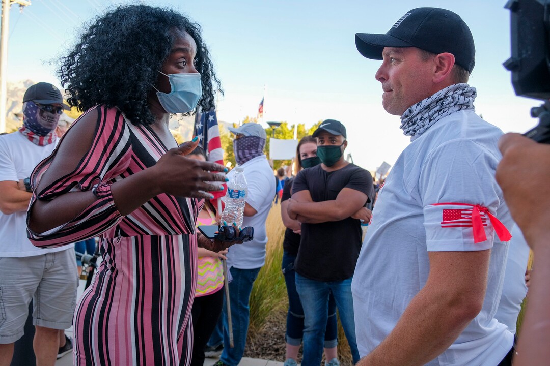 (Leah Hogsten  |  The Salt Lake Tribune) l-r Josianne Petit, leader of Mama and Papa Panthers asks Casey Robertson, founder and president of Utah Citizens' Alarm to stand down and not attend an upcoming rally for Darrien Hunt. Five days after after nine protesters were arrested during a peaceful rally in memory of Zane James that turned into a violent clash with Cottonwood Heights officers, demonstrators gathered outside the police station Friday to denounce CHPD's actions and its officers for inciting the violence.