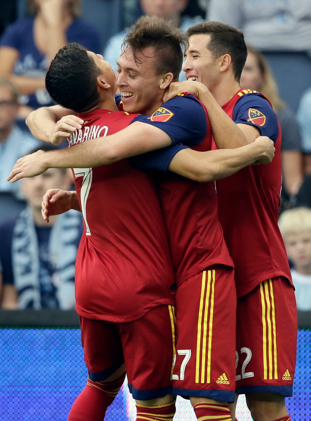 Real Salt Lake forward Corey Baird (27) celebrates his goal with teammates Jefferson Savarino (7) and Aaron Herrera (22) during the first half of an MLS soccer match against Sporting Kansas City in Kansas City, Kan., Sunday, Sept. 30, 2018. (AP Photo/Orlin Wagner)