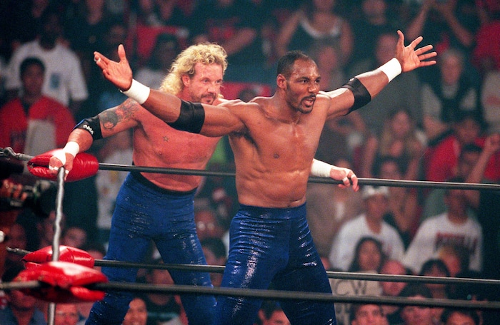 (Trent Nelson | The Salt Lake Tribune) Diamond Dallas Page and Karl Malone at WCW's Bash at the Beach in San Diego. July 12, 1998.