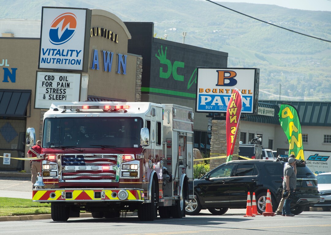 (Rick Egan | The Salt Lake Tribune) Bountiful police investigate after they say a store clerk shot an armed robbery suspect at Bountiful Pawn and Sales on Thursday, May 3, 2018. Police are looking for a second suspect in the attempted armed robbery.